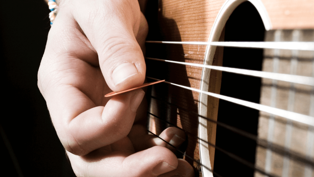 how to strum a guitar with a guitar pick