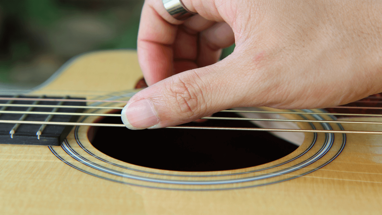 playing guitar long nails